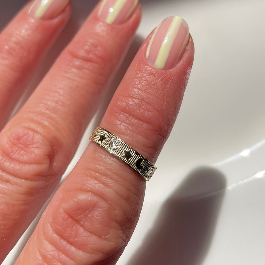 Hand with a ring on a white background