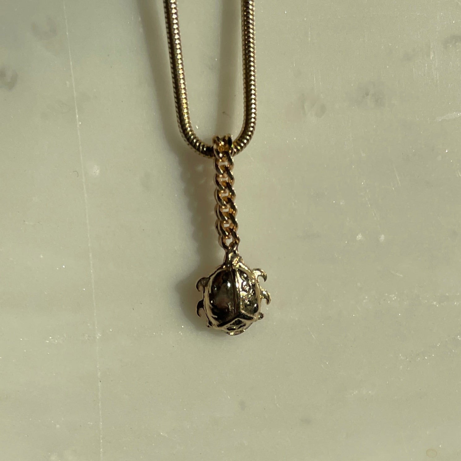 Gold beetle chain charm