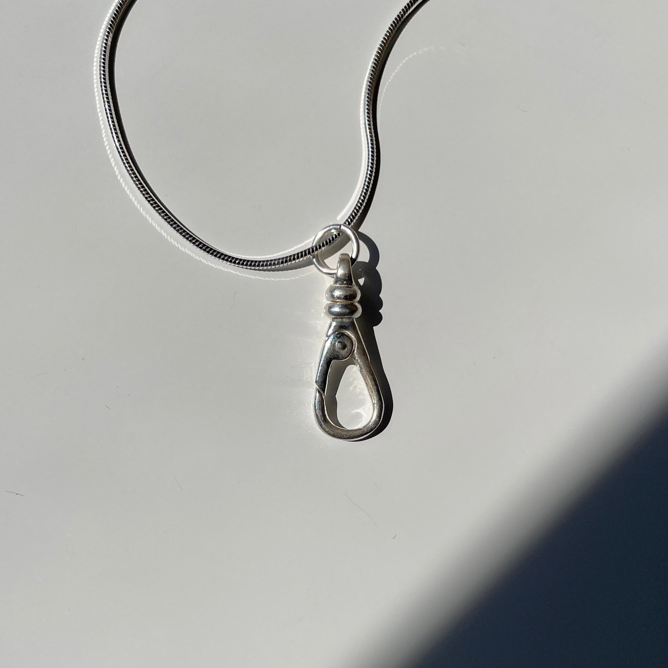 Sterling silver push clip charm holder