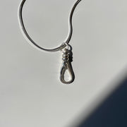 Sterling silver push clip charm holder