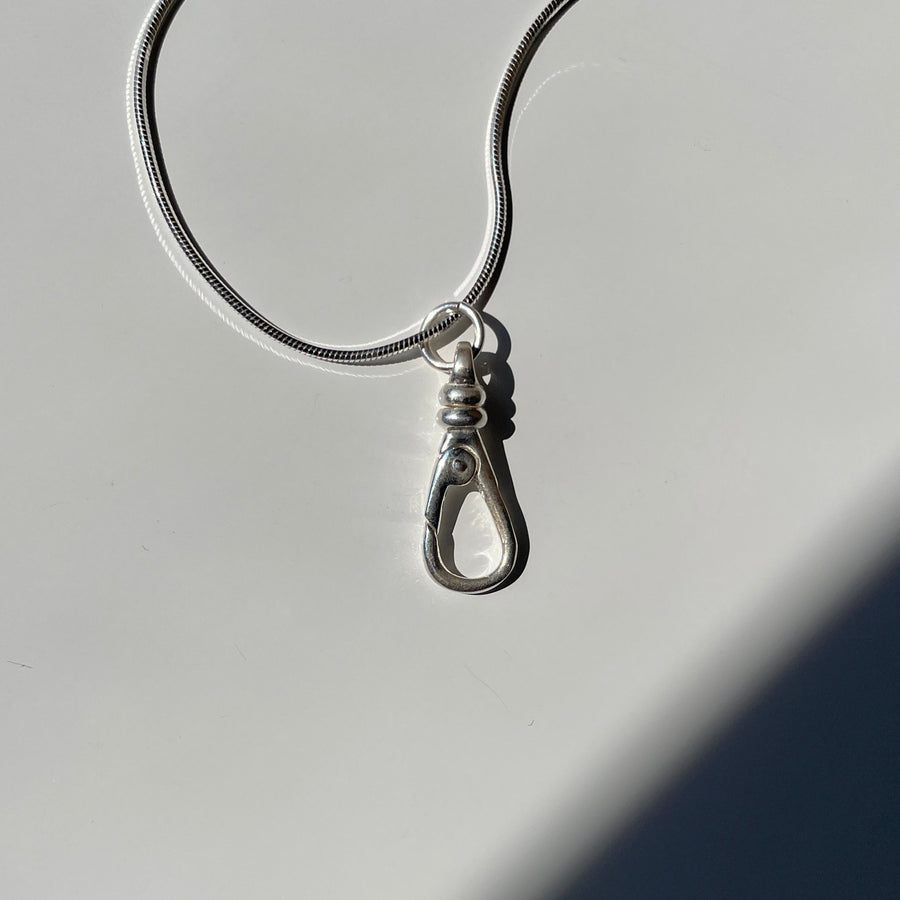 Sterling silver push clip charm holder