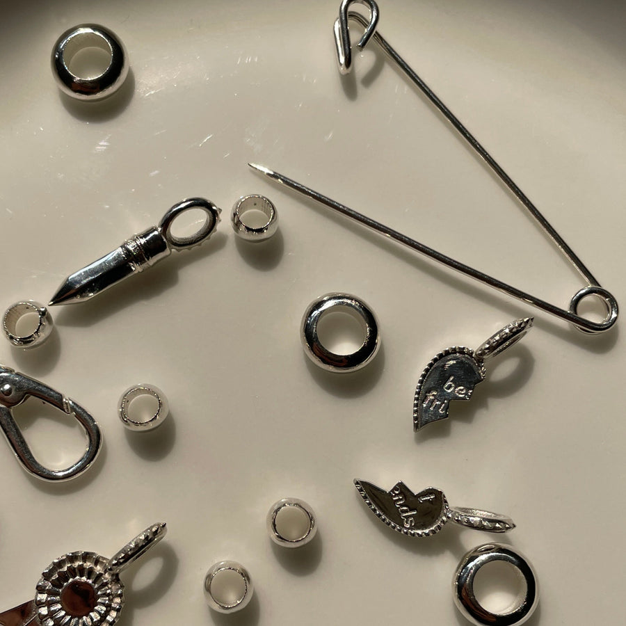 Collection of silver charms