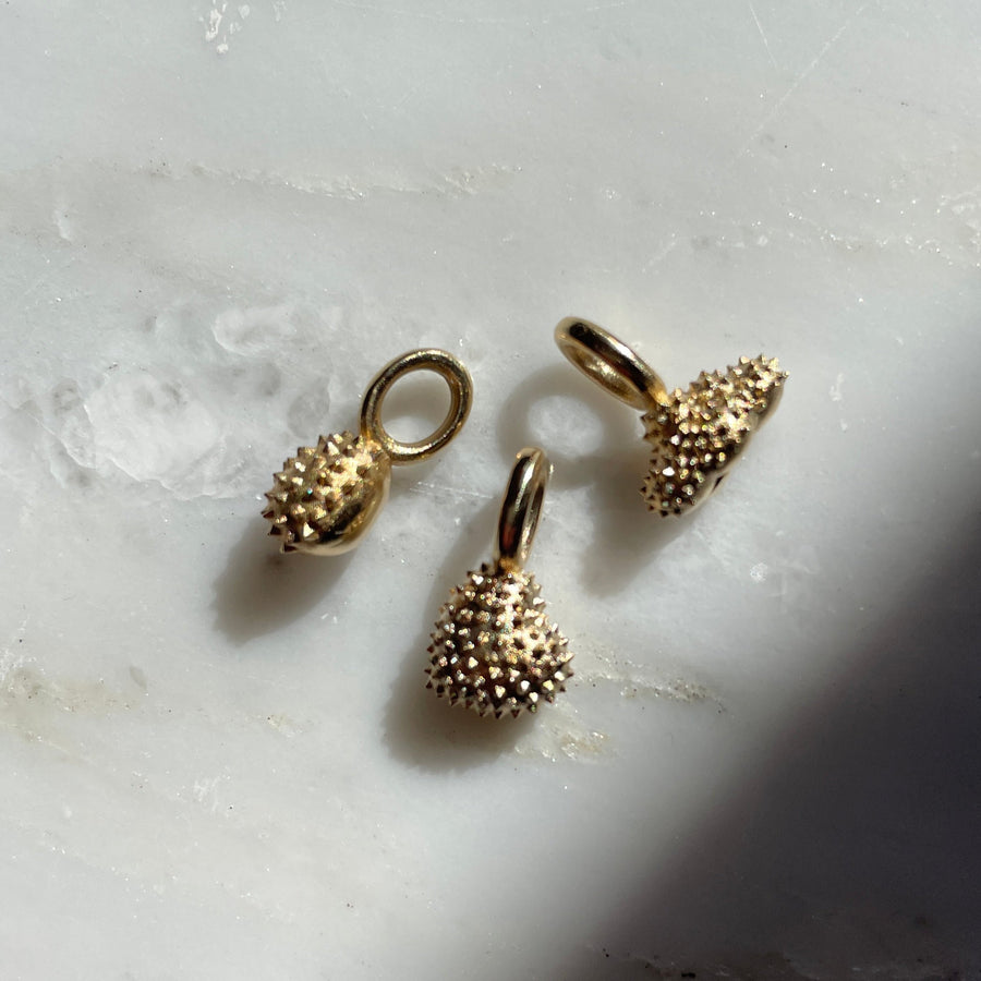 Spiky gold charms