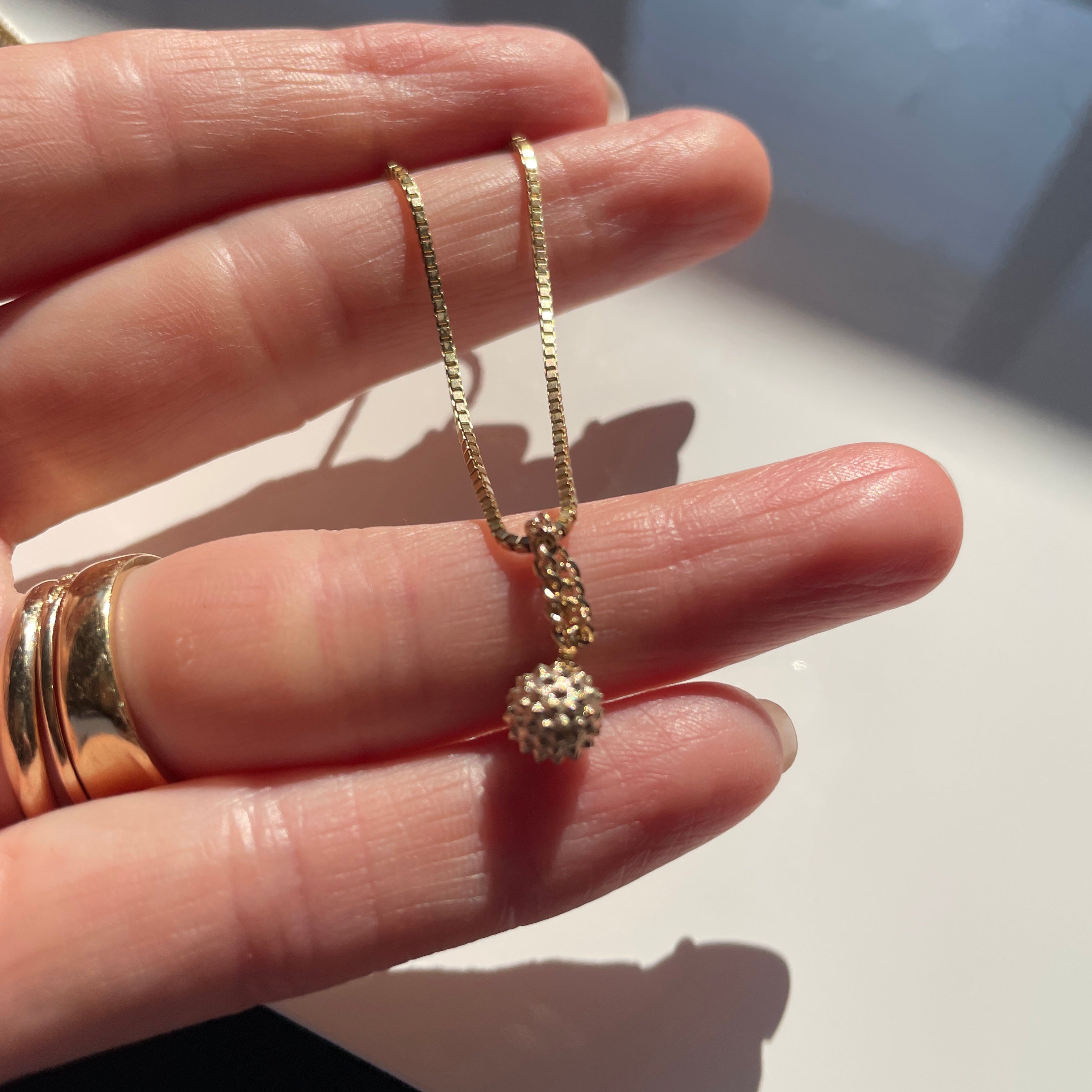 Gold Wrecking ball charm