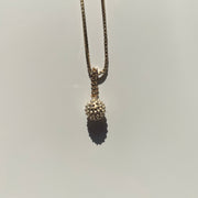 Gold wrecking ball charm