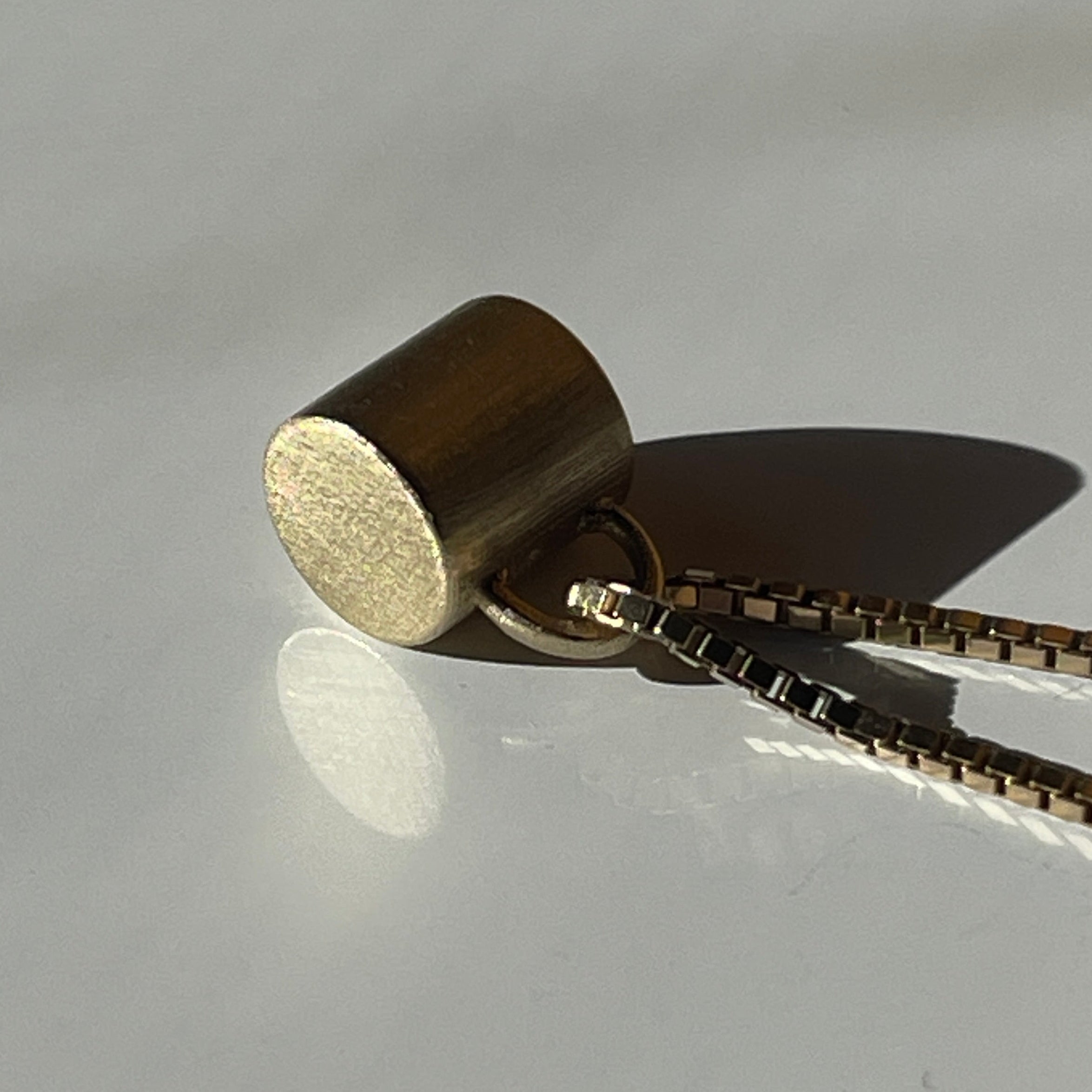 Gold Coffe cup with tiger's eye cabochon 