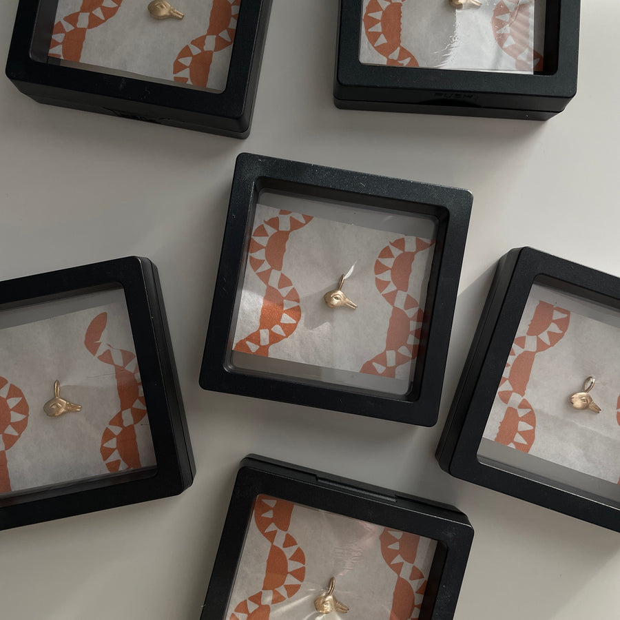 Gold Duck-rabbit Charm packaged
