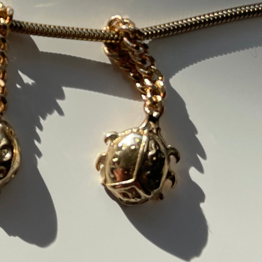 Gold beetle chain charm