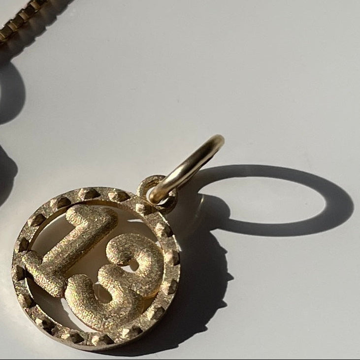 Satin gold 13 charm
